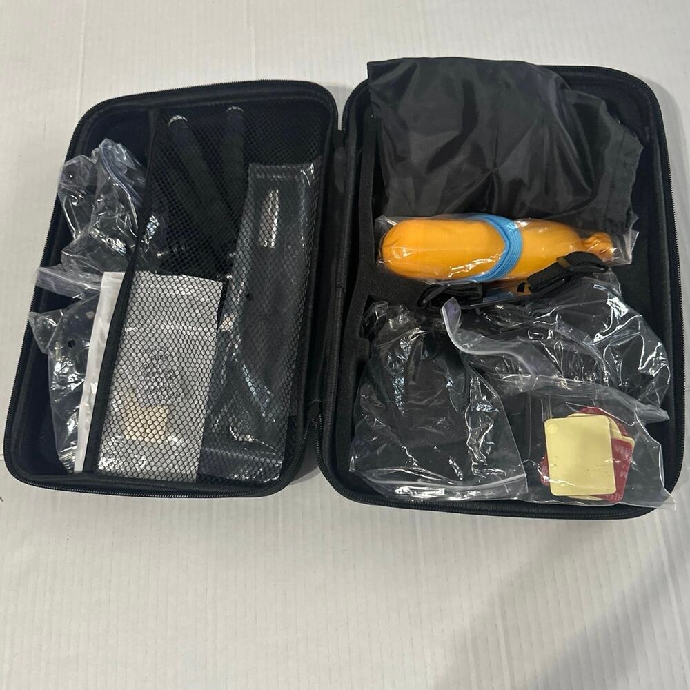 Action camera accessory kit w/ a carrying case. Head, chest straps& underwater